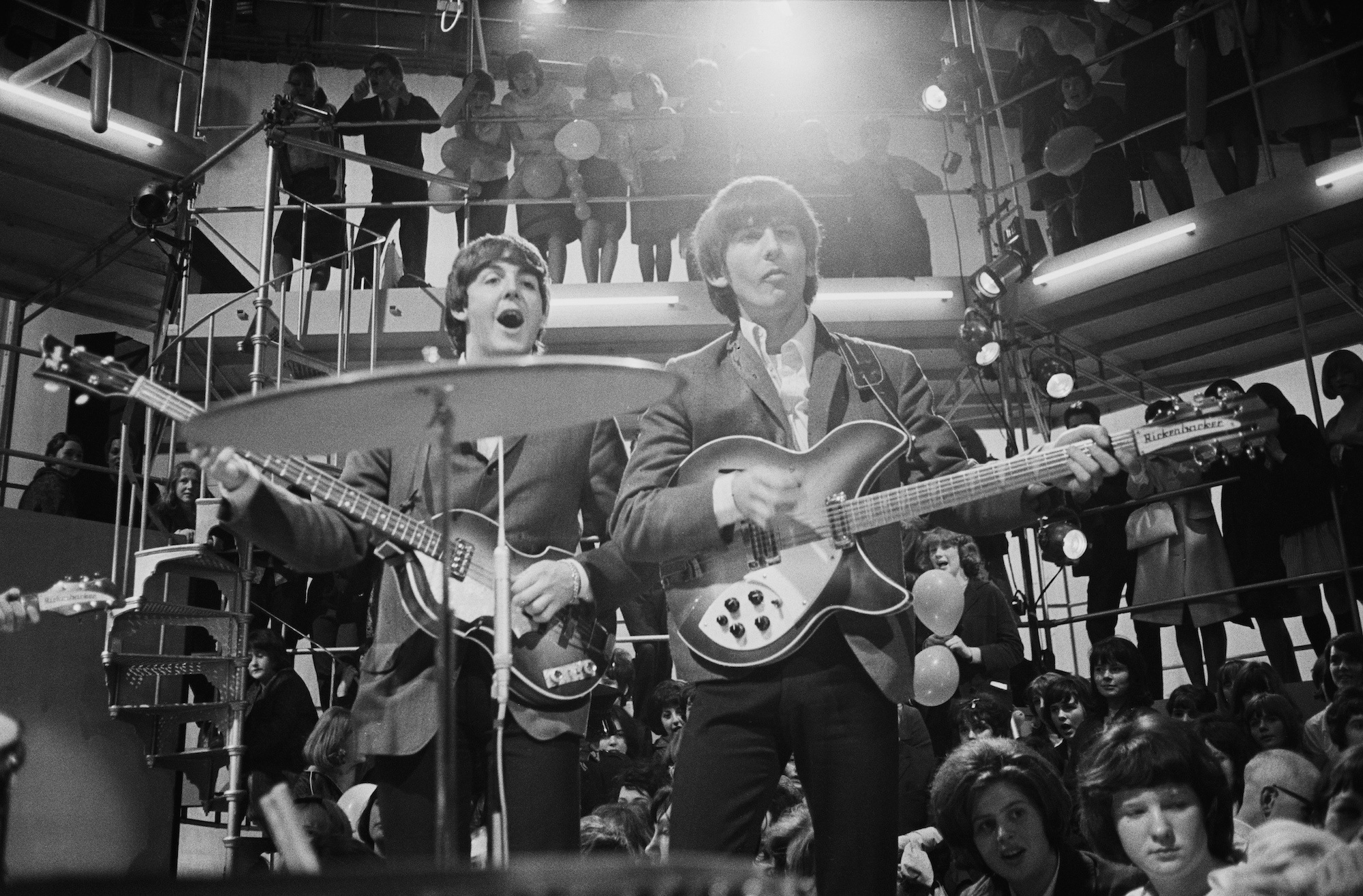 Paul McCartney and George Harrison play at a rehearsal for the 'Round The Beatles' TV show