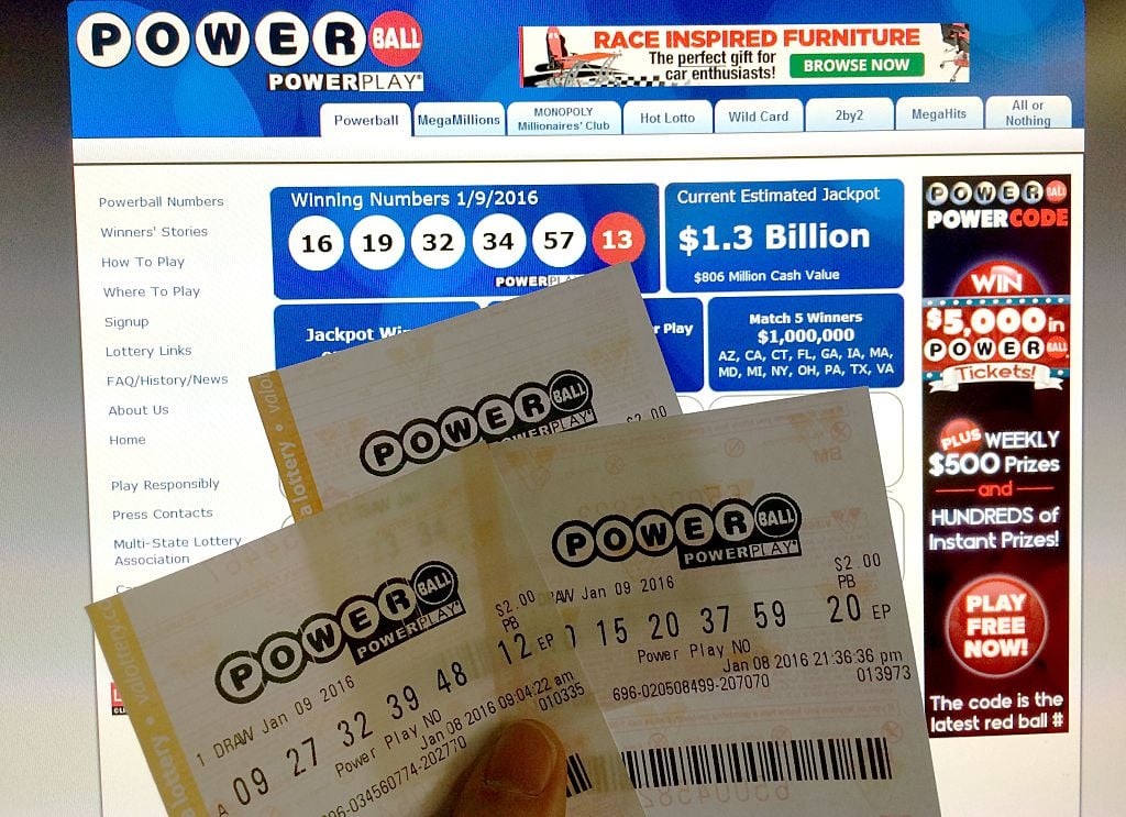 Person holding Powerball lottery tickets