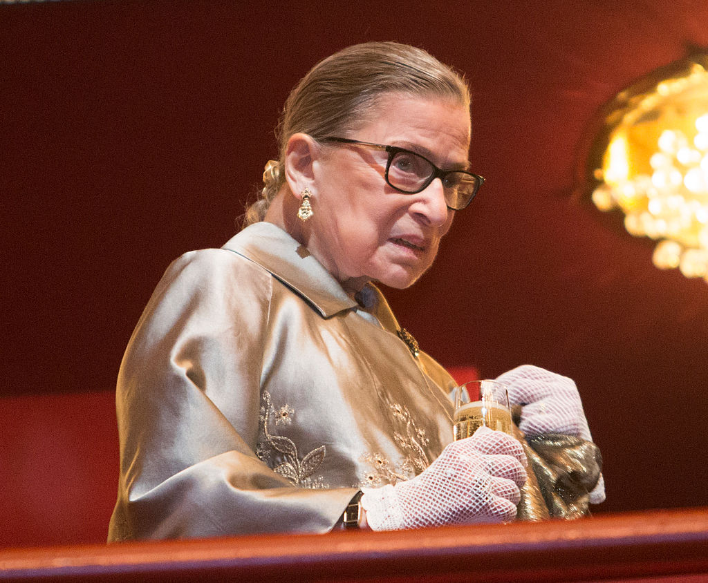 Supreme Court Justice Ruth Bader Ginsburg takes a refreshment during intermission at The Kennedy Center Honors 2015