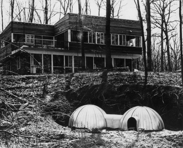A two-unit fallout shelter of the kind recommended by the U.S. Civil Defense Office. It combines two steel igloo shelters and provides accommodation for six people