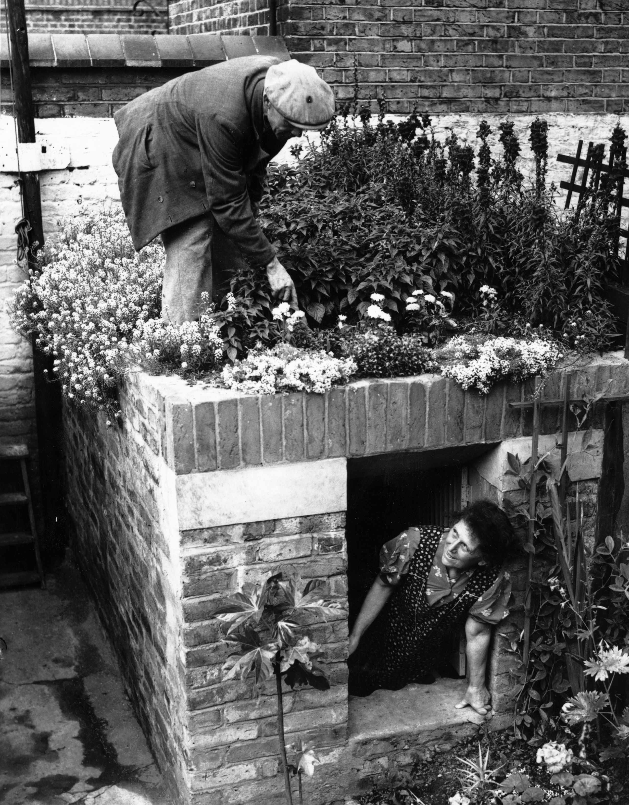 Mr. and Mrs. Joseph Pigot with their novel air-raid shelter Mr. and Mrs. Joseph Pigot with their novel air-raid shelter