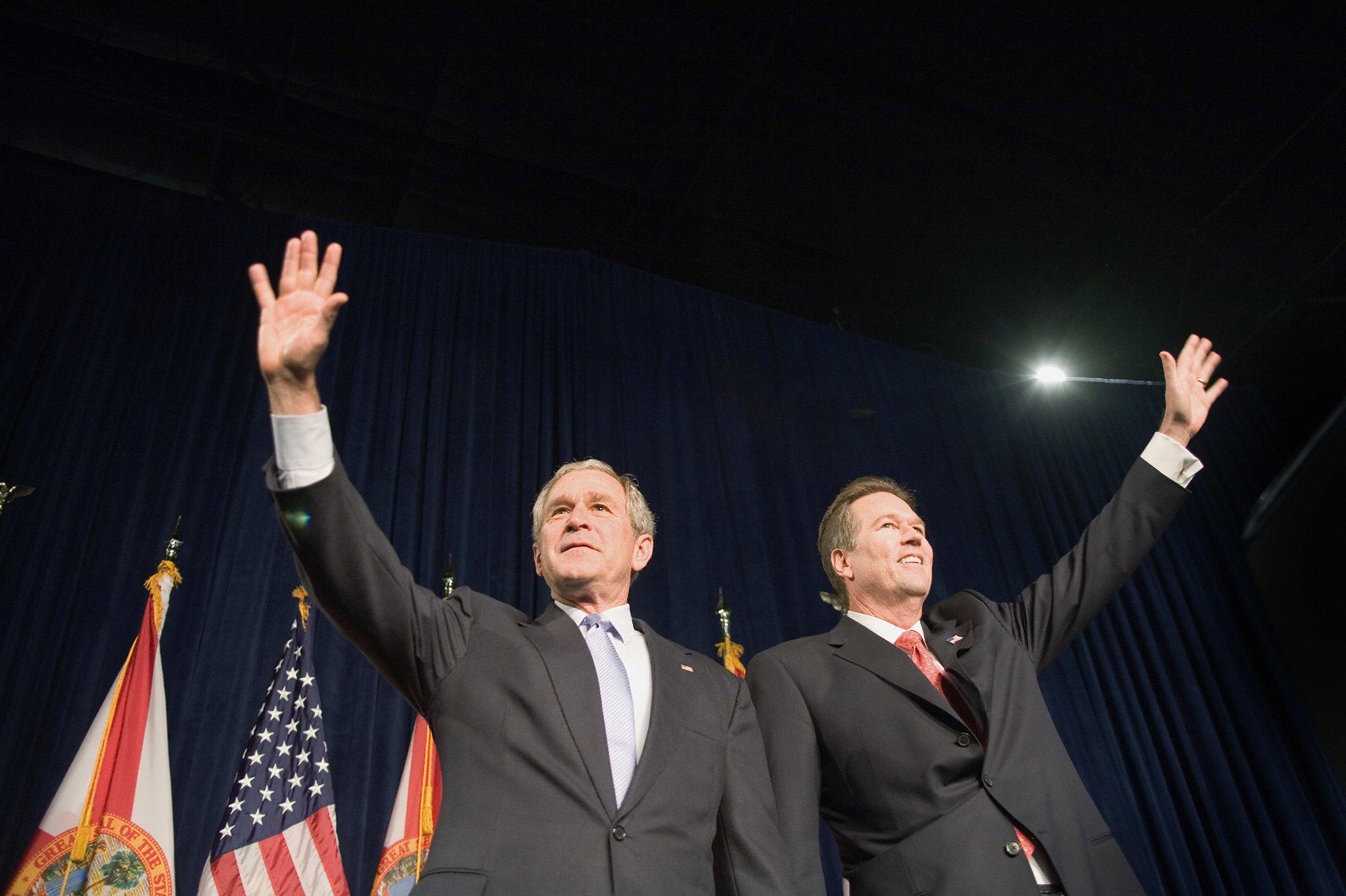 George W. Bush (L) waves to the crowd with Vern Buchanan George W. Bush (L) waves to the crowd with Vern Buchanan