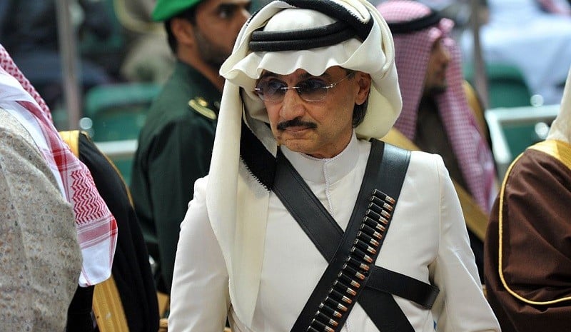 Saudi billionaire owner of Kingdom Holding Company, Prince al-Waleed bin Talal attends the traditional Saudi dancing best known as 'Arda' performed during Janadriya culture festival at Der'iya in Riyadh, on February 18, 2014. Charles arrived in Saudi Arabia on a private visit.