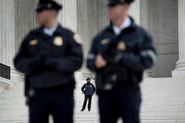 Police guard the Supreme Court