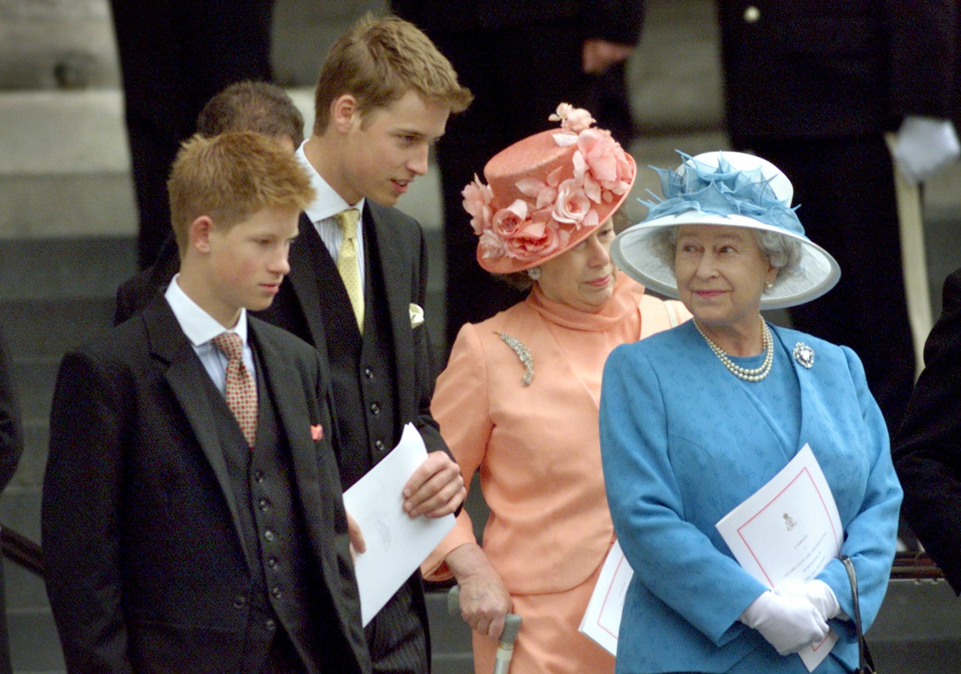 Britain's Queen Elizabeth (R) waits on the steps of St. Paul's Cathedral with her grandsons Prince Harry (L), Prince William (2nd L) and Princess Margaret (2nd R) after attending a national service of thanksgiving in celebration of The Queen Mother's forthcoming 100th birthday in London