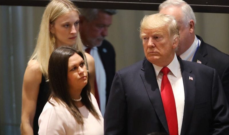 President Donald Trump attends a meeting on the global drug problem at the United Nations (UN) with White House press secretary Sarah Huckabee Sanders a day ahead of the official opening of the 73rd United Nations General Assembly on September 24, 2018 in New York City. The United Nations General Assembly, or UNGA, is expected to draw 84 heads of state and 44 heads of government in New York City for a week of speeches, talks and high level diplomacy concerning global issues. New York City is under tight security for the annual event with dozens of road closures and thousands of security officers patrolling city streets and waterways.