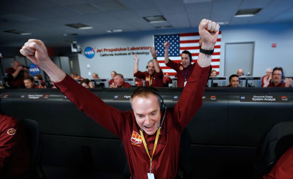 NASA engineer Kris Bruvold reacts after the successful Mars landing by the InSight spacecraft.