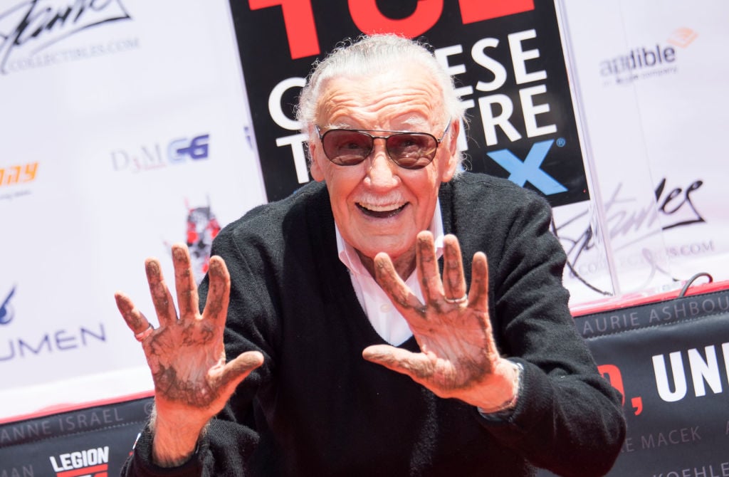 Comic-book writer, editor, and publisher Stan Lee places his hands in cement during his hand and footprint ceremony at TCL Chinese Theatre IMAX, on July 18, 2017, in Hollywood, California.