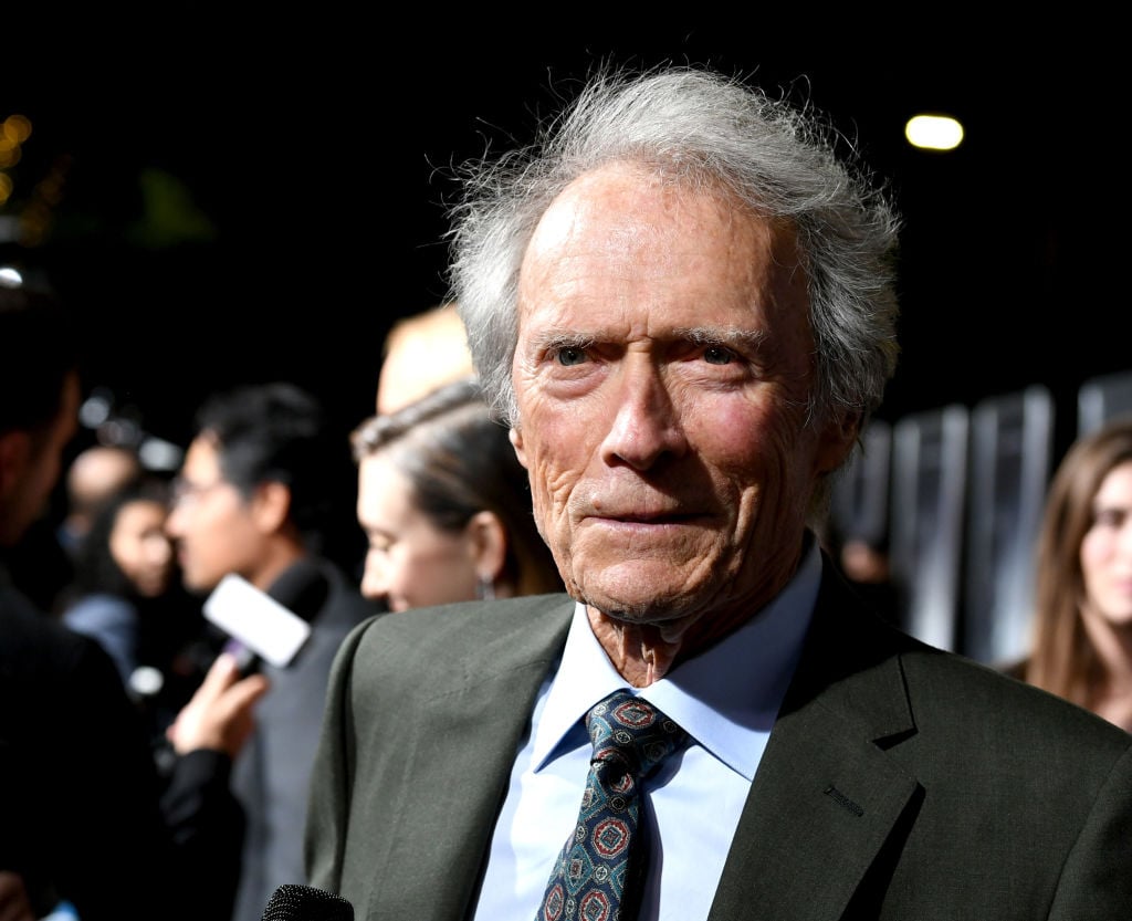 Clint Eastwood from the chest up wearing a suit