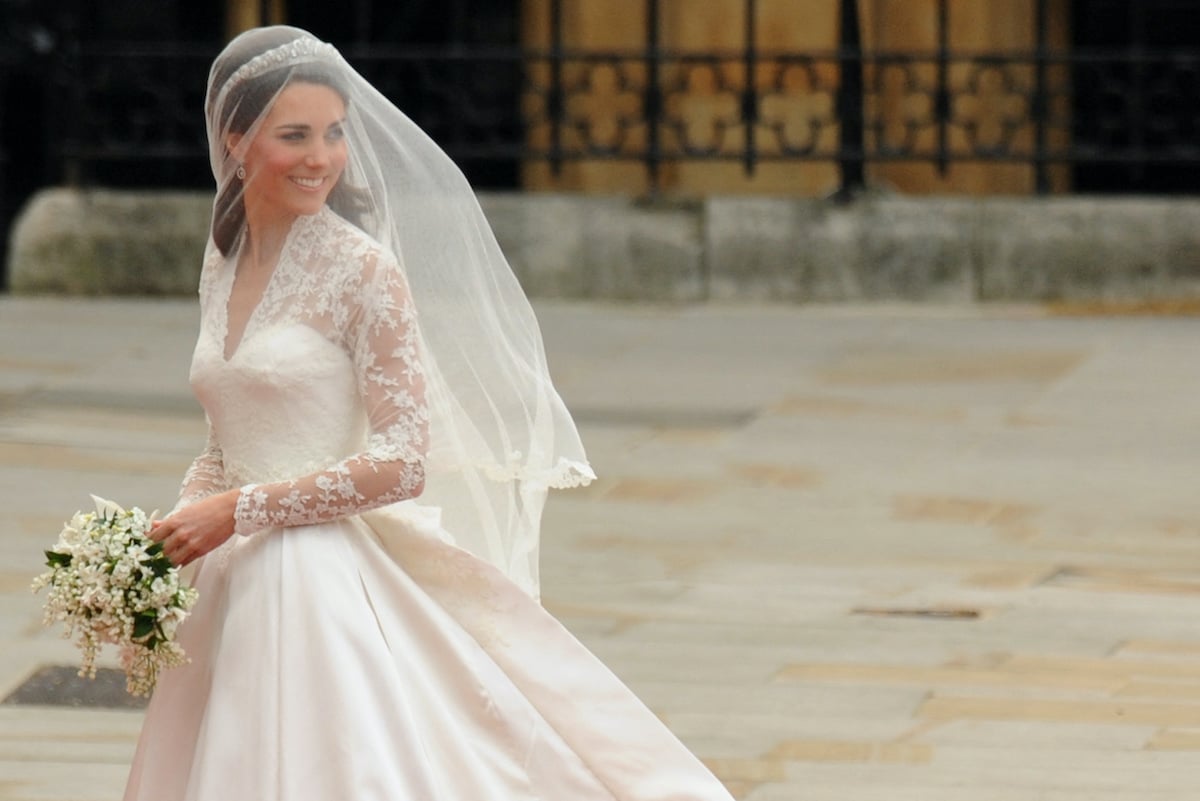 Kate Middleton in her wedding dress looking over her shoulder