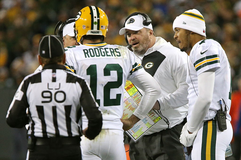 Mike McCarthy talks to Aaron Rodgers Head coach Mike McCarthy of the Green Bay Packers talks with quarterback Aaron Rodgers in the first quarter against the Chicago Bears at Lambeau Field on October 20, 2016 in Green Bay, Wisconsin.