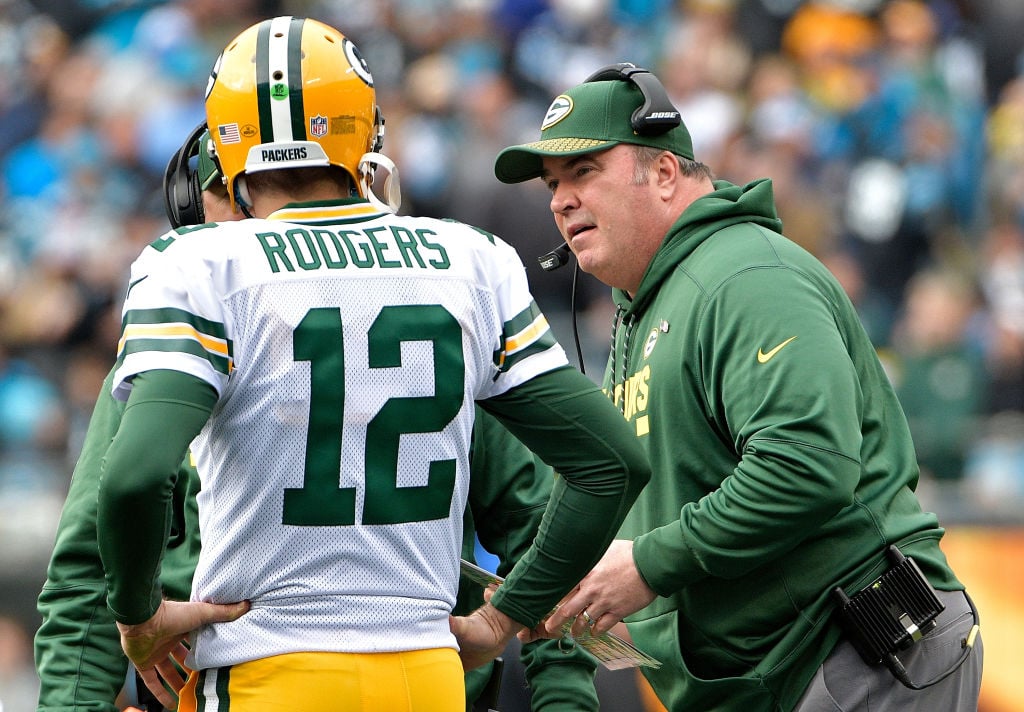 Mike McCarthy and Aaron Rodgers Head coach Mike McCarthy talks to Aaron Rodgers of the Green Bay Packers in the second quarter against the Carolina Panthers at Bank of America Stadium on December 17, 2017 in Charlotte, North Carolina.