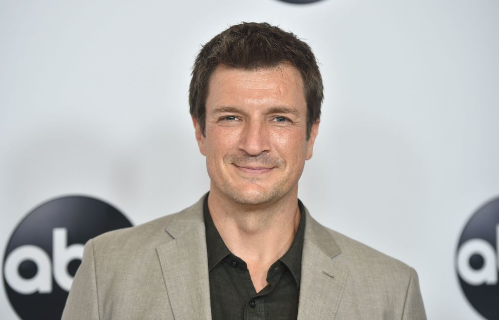 Actor Nathan Fillion smiles for the camera.