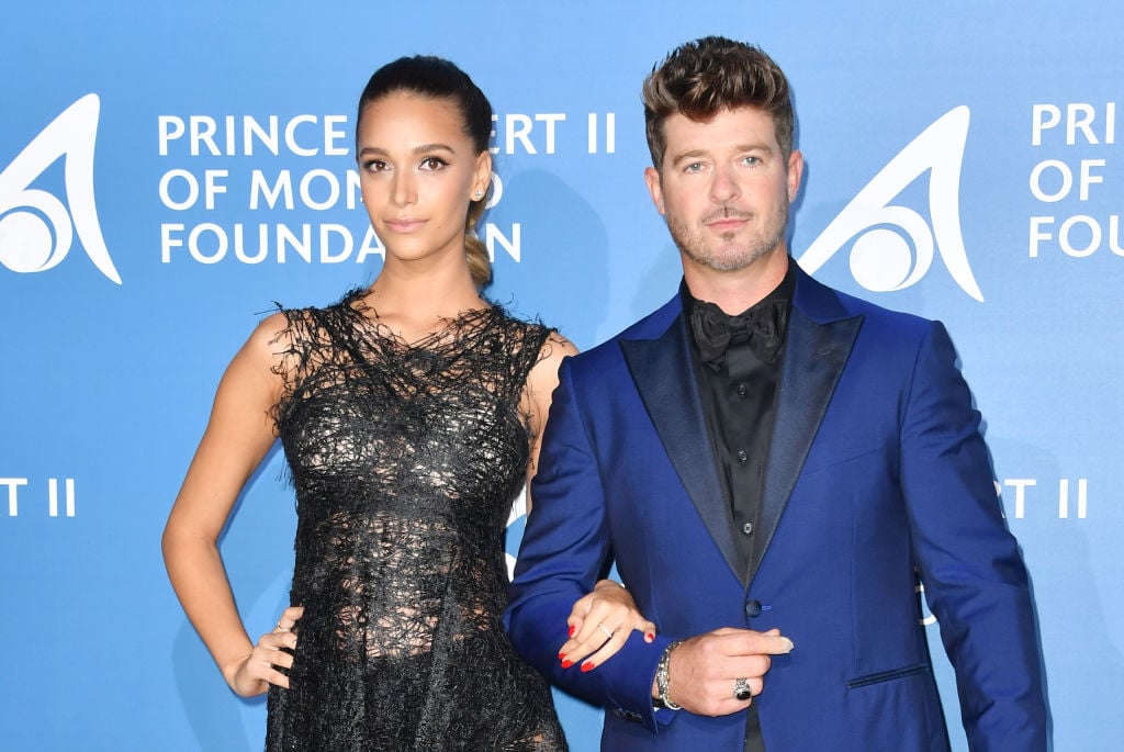 Robin Thicke and April Love Geary pose during the Monte-Carlo Gala for the Global Ocean in Monaco on September 28, 2017.