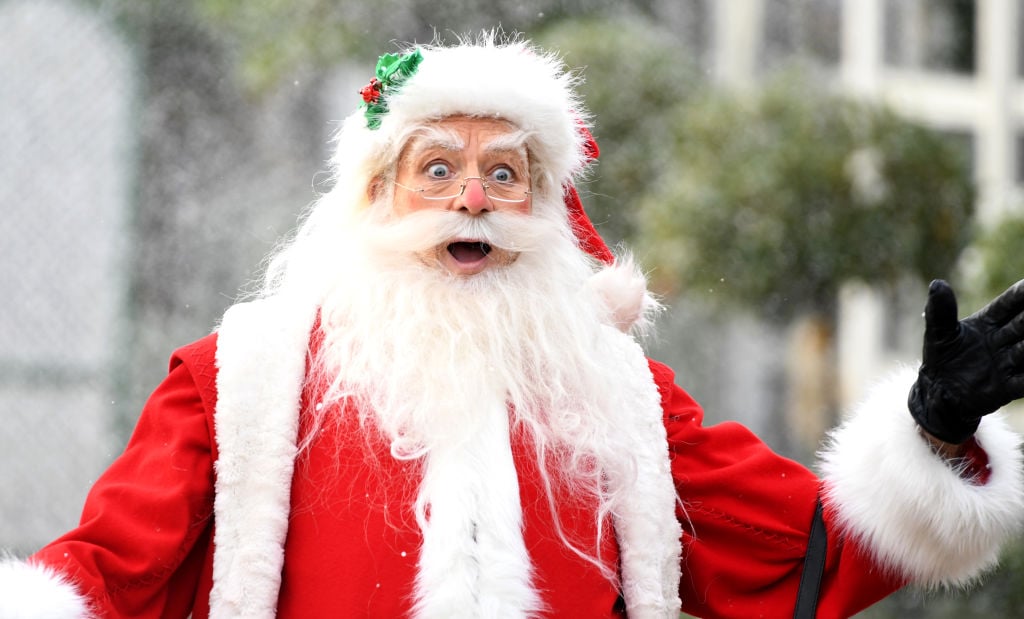 A surprised Santa Claus just saw his paycheck.