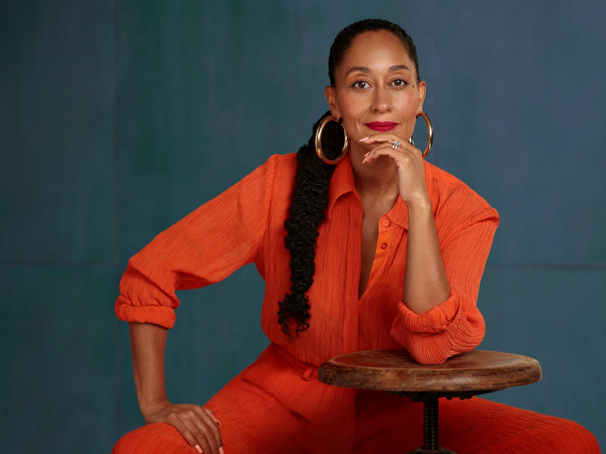 Tracee Ellis Ross posing in an orange outfit for ABC's 'Black-ish' Season 7 promo shoot