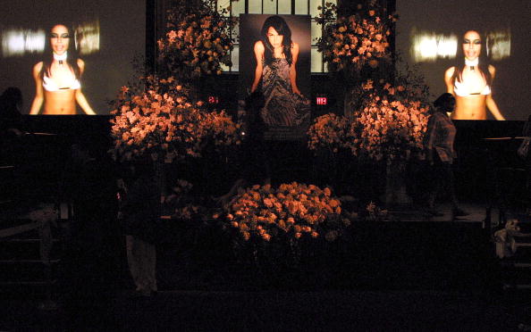 Fans hold a memorial for the late R&B singer Aaliyah at Cipriani restaurant, as the funeral service is held at St. Ignatius Loyola Church, August 31, 2001 in New York City. The 22-year-old singer died August 25 in a plane crash in the Bahamas. 