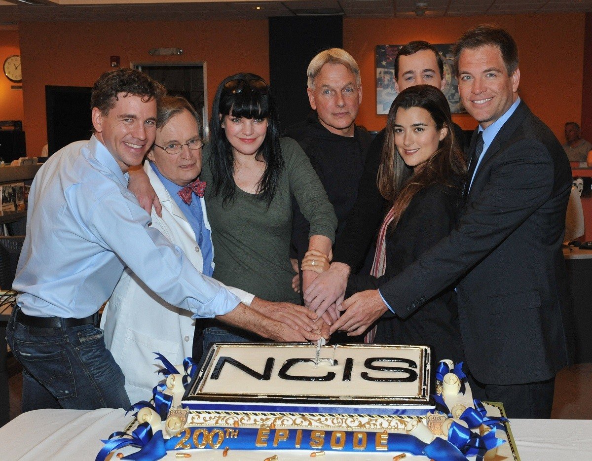 Brian Dietzen, David McCallum, Paukley Perrette, Mark Harmon, Sean Murray, Cote de Pablo, and Michael Weatherly celebrate 200 episodes of NCIS in 2012.