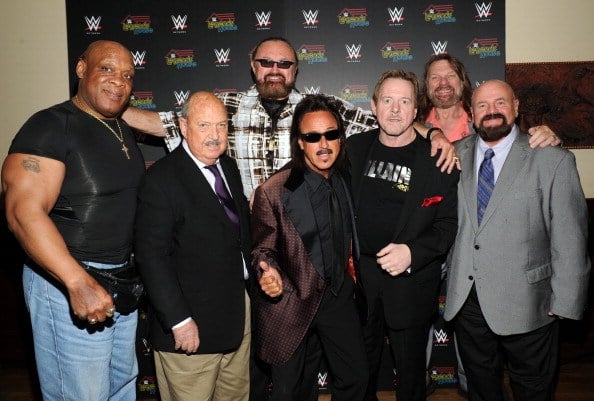Gene Okerlund and "Legends House" cast members Cast members Tony Atlas, Gene Okerlund, Hillbilly Jim, Jimmy Hart, Rowdy Roddy Piper, "Hacksaw" Jim Duggan and Howard Finkel attend the WWE screening of "Legends' House" at Smith & Wollensky on April 15, 2014 in New York City.