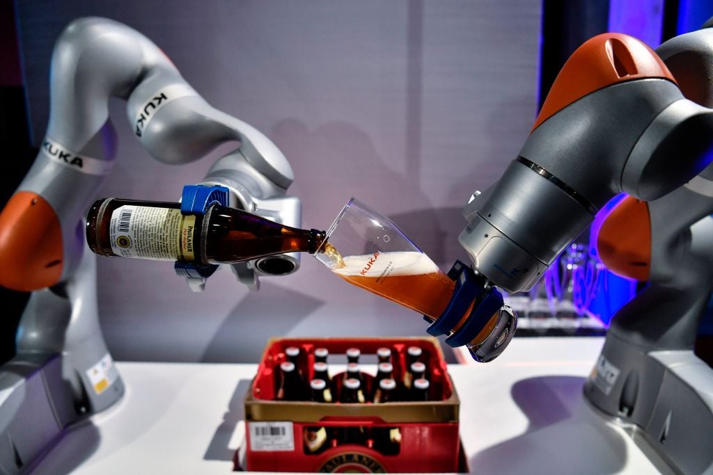 Robot arms pouring a beer