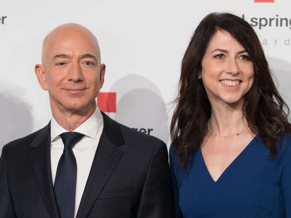Amazon CEO Jeff Bezos and his wife MacKenzie Bezos pose as they arrive at the headquarters of publisher Axel-Springer where he will receive the Axel Springer Award 2018 on April 24, 2018 in Berlin. 