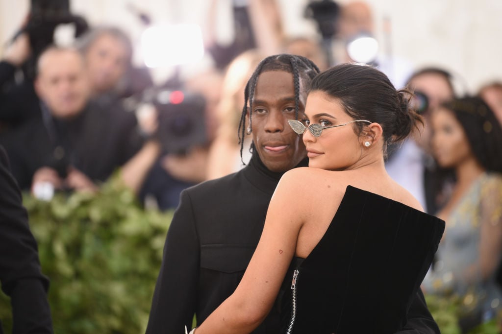 Travis Scott and Kylie Jenner Travis Scott and Kylie Jenner attend the Heavenly Bodies: Fashion & The Catholic Imagination Costume Institute Gala at The Metropolitan Museum of Art on May 7, 2018 in New York City.