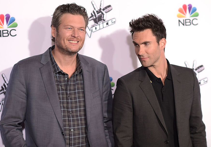 Adam Levine starring down Blake Shelton