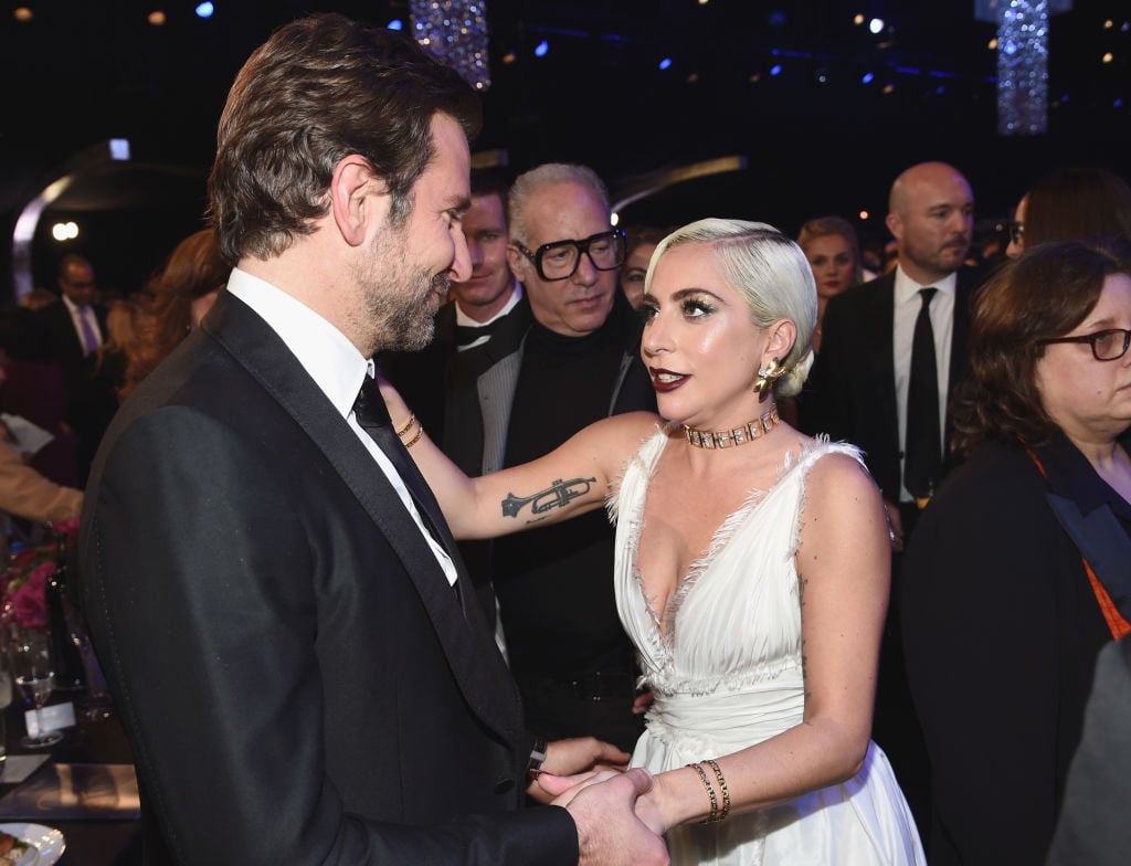 Bradley Cooper and Lady Gaga holding hands | Dimitrios Kambouris/Getty Images for Turner