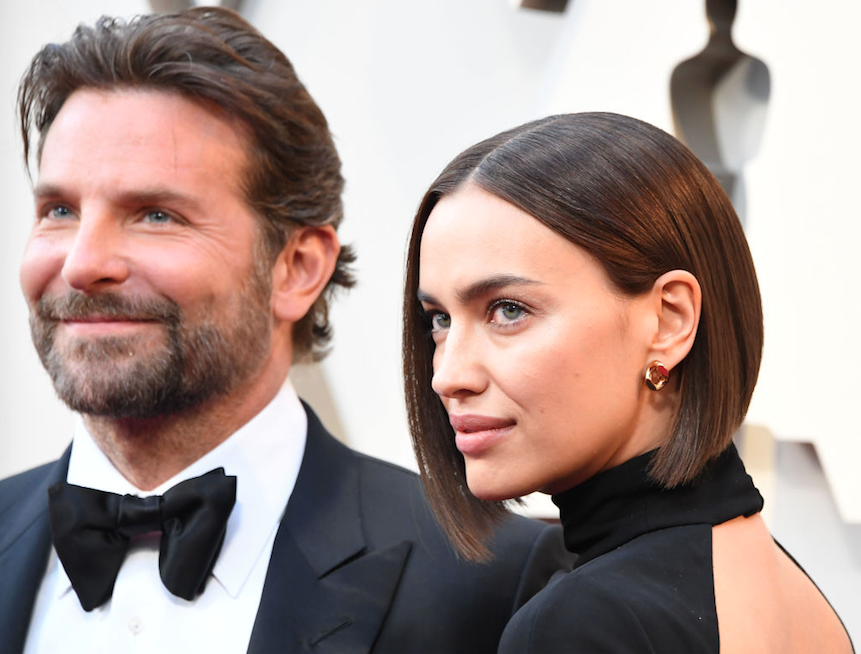 Bradley Cooper and Irina Shayk posing for photos at the Oscars