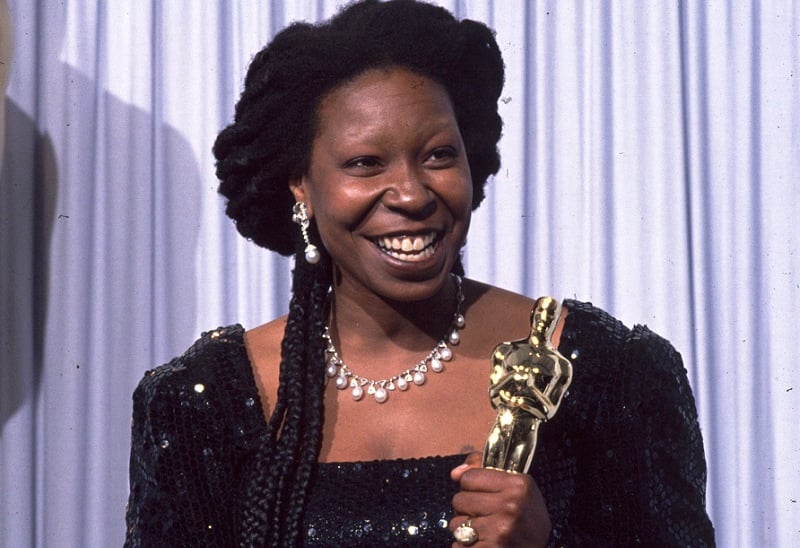 Whoopi Goldberg receives an Oscar at the 63rd Academy Awards on March 25, 1991 | John Barr/Liaison