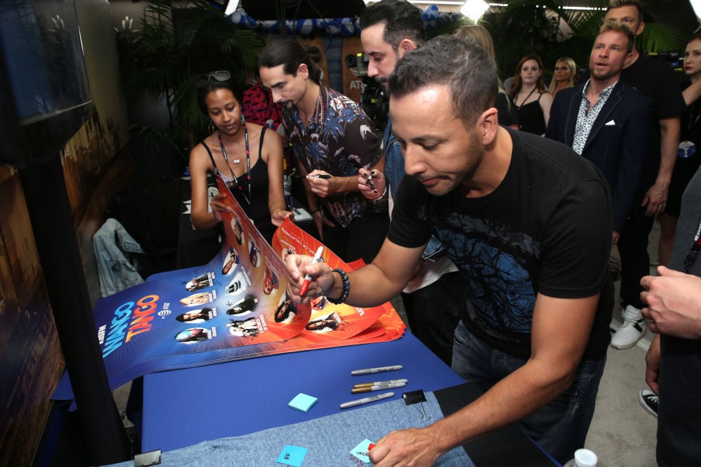 Kevin Richardson, AJ McLean and Howie Dorough of the Backstreet Boys sign posters backstage at the 2018 iHeartRadio Wango Tango by AT&T at Banc of California Stadium on June 2, 2018 in Los Angeles, California. 