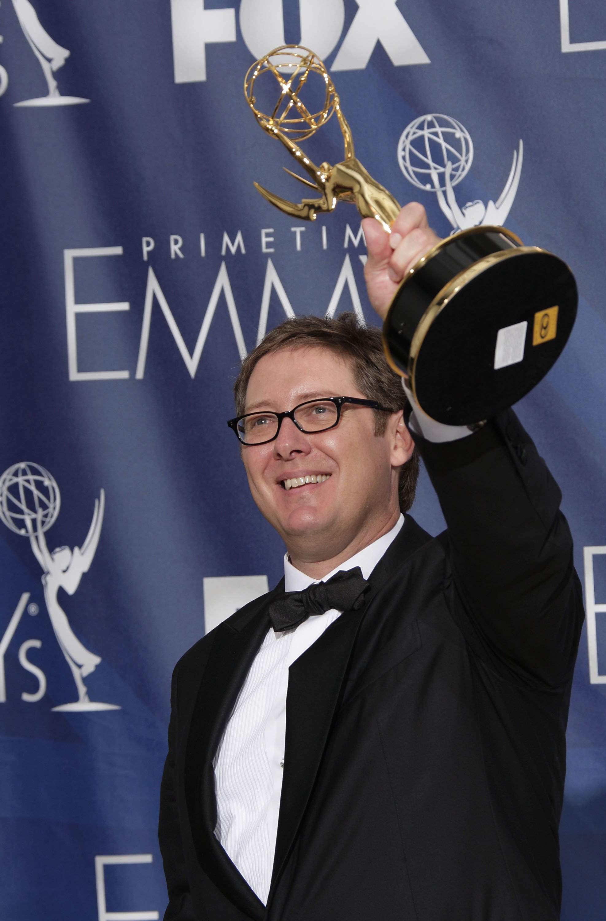 James Spader, star of The Blacklist, hoists an Emmy award