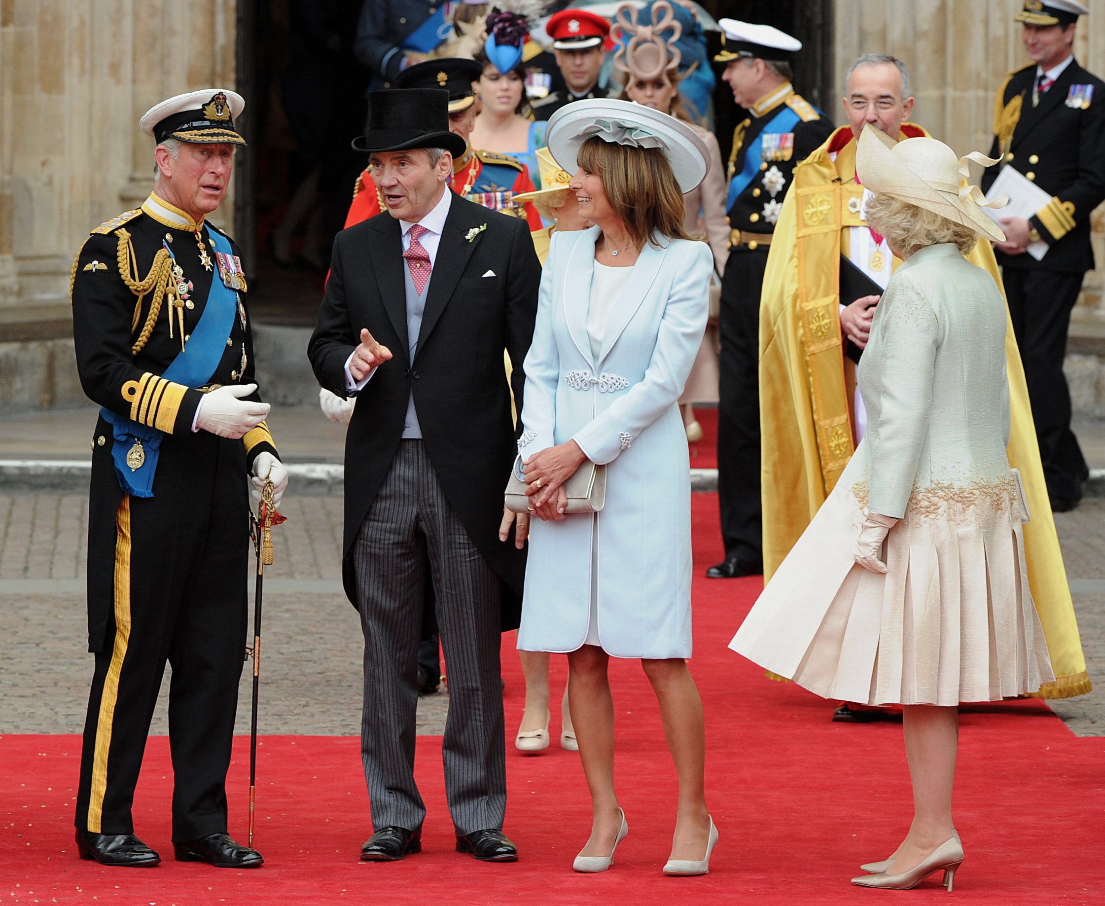 Michael and Carole Middleton chat with Prince Charles and Camilla Parker Bowles following Kate Middleton and Prince William's royal wedding.