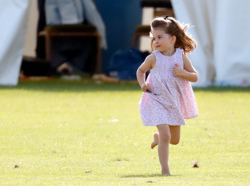 Princess Charlotte runs in a park.