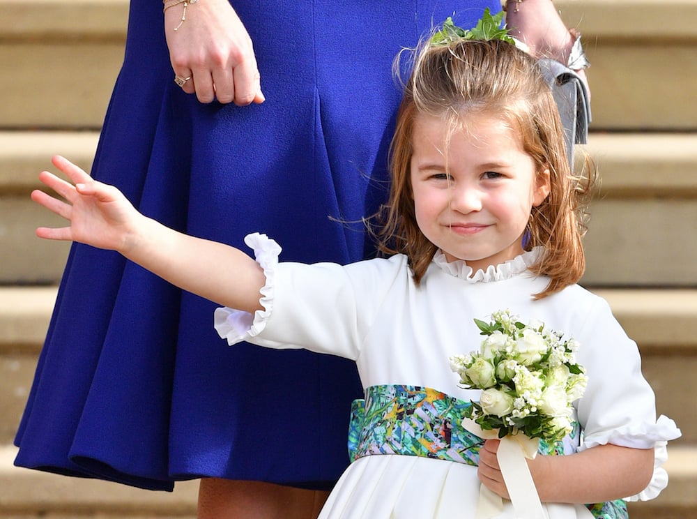 Princess Charlottes waves to crowd at Prince Harry and Meghan Markle's royal wedding. 