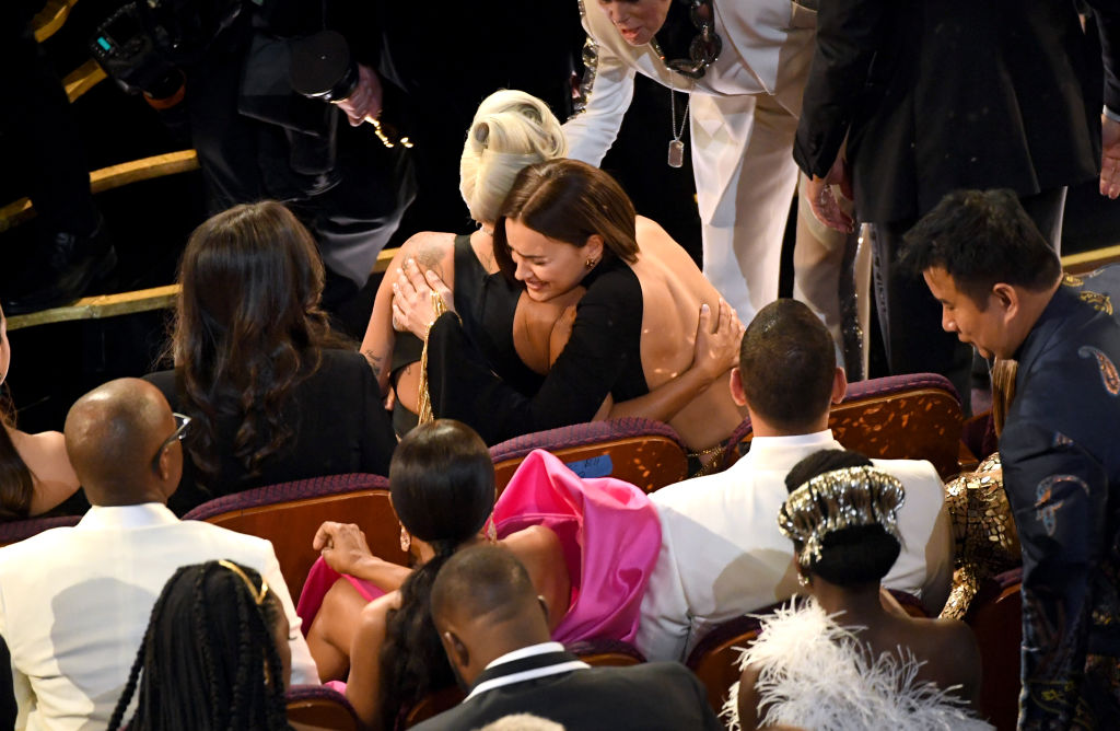Bradley Cooper's girlfriend Irina Shayk and Lady Gaga hug at the 2019 Oscars.