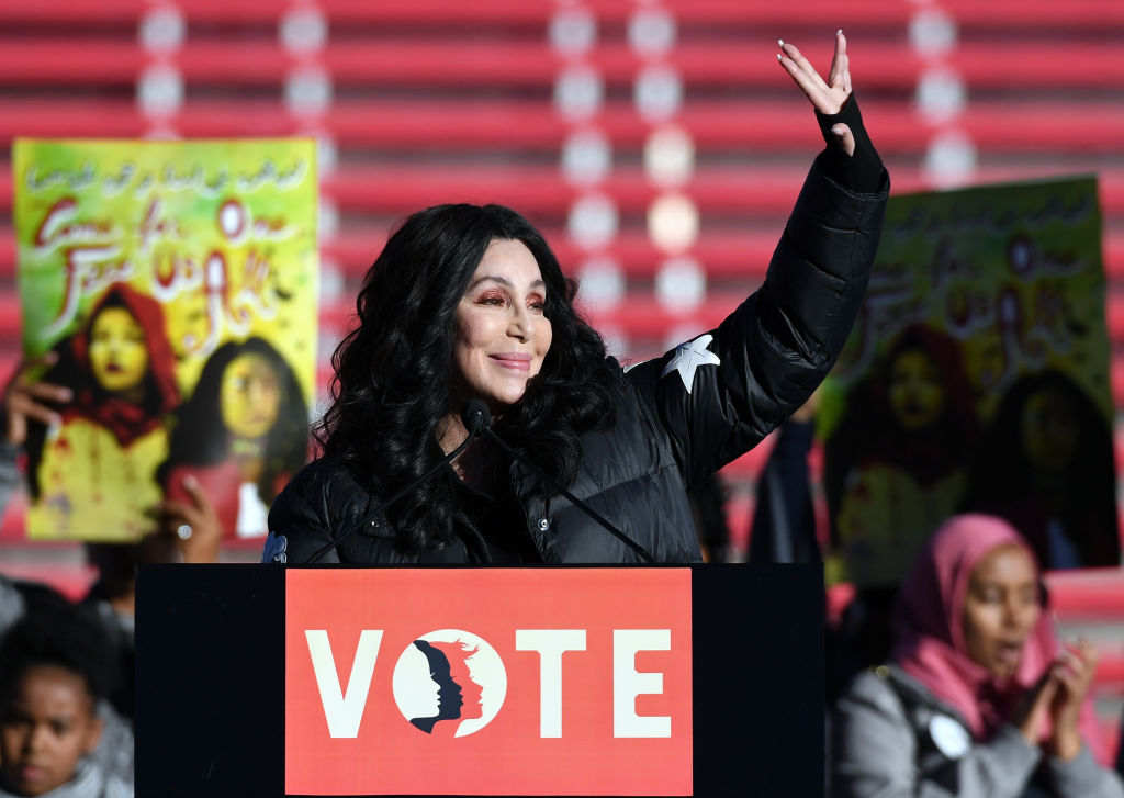 Cher waves after speaking during the 2018 Women's March