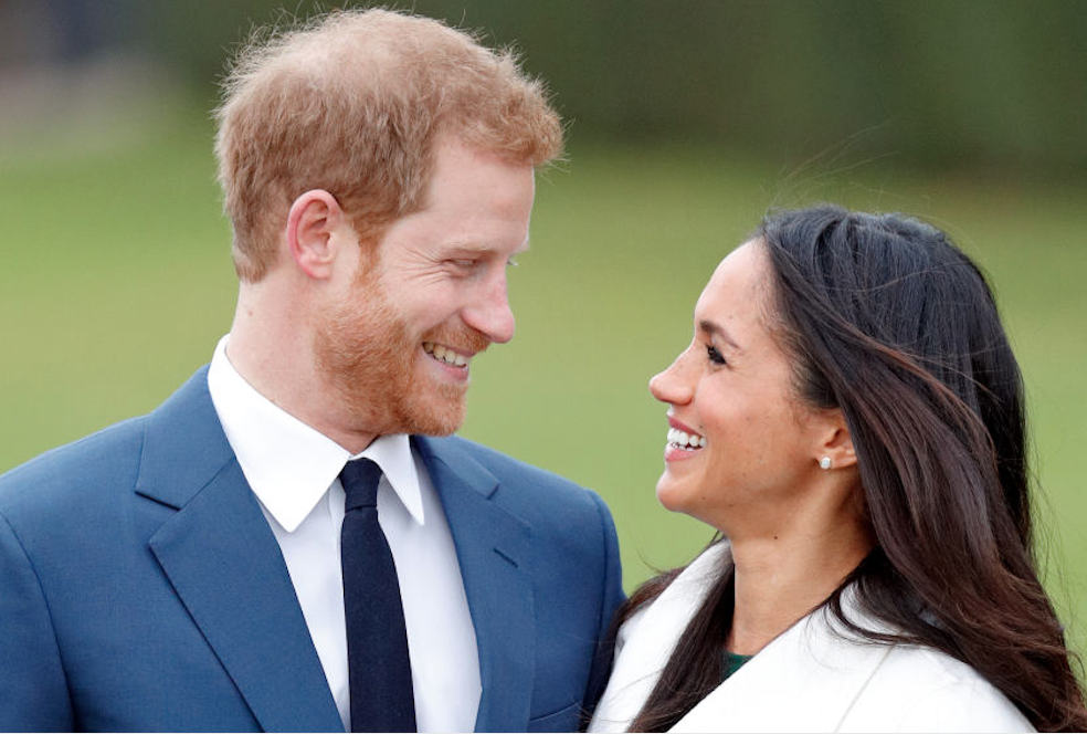 Prince Harry smiling at Meghan Markle