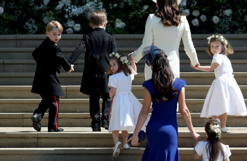 Prince George and Princess Charlotte walk up the steps at Prince Harry and Meghan Markle's royal wedding.