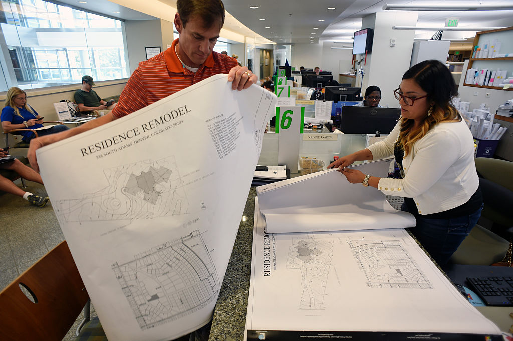 Contractor holding building plans