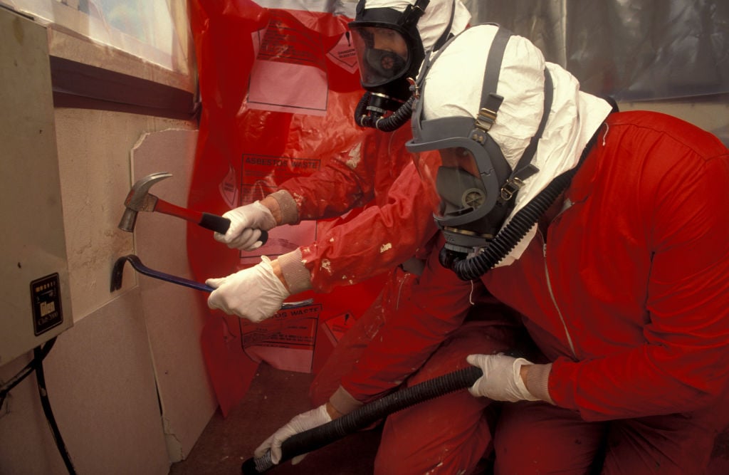 A team works on removing asbestos