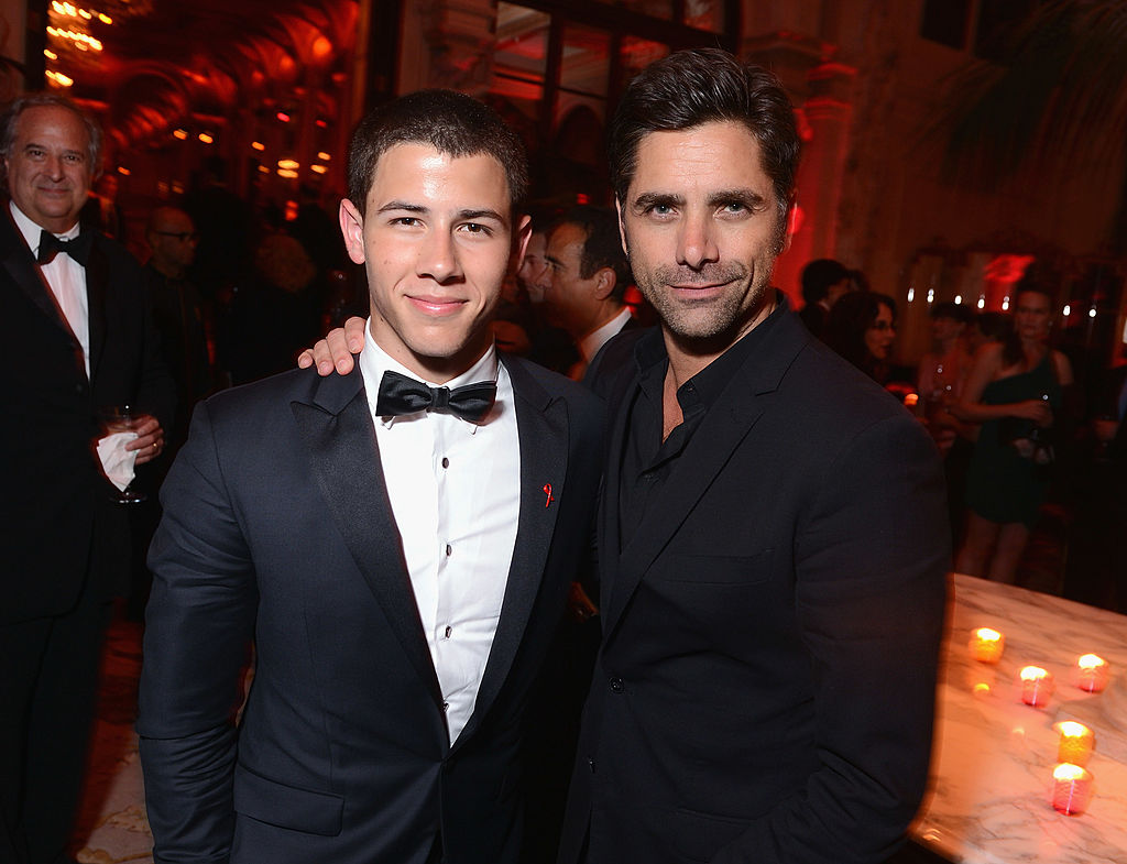 Nick Jonas and John Stamos at the 2012 Tony Awards after party.