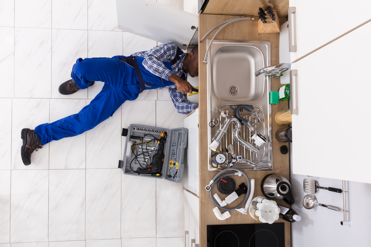 Handyman fixing a sink