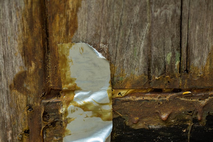 Wooden door fixed with duct tape