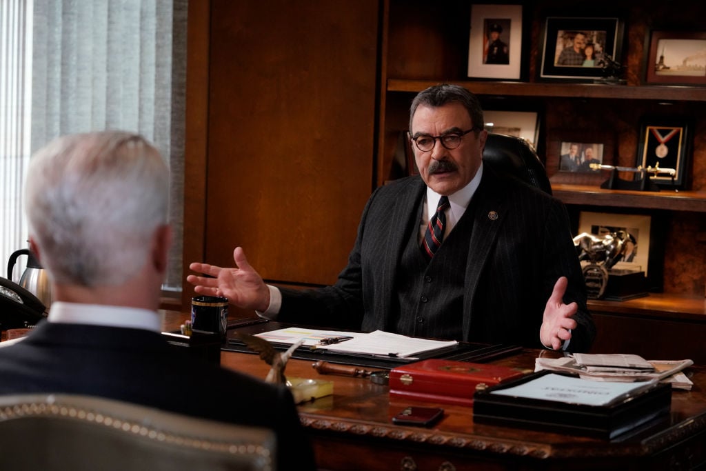 Gregory Jbara as Garrett Moore and Tom Selleck as Frank Reagan