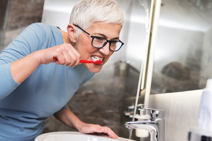Woman brushing her teeth