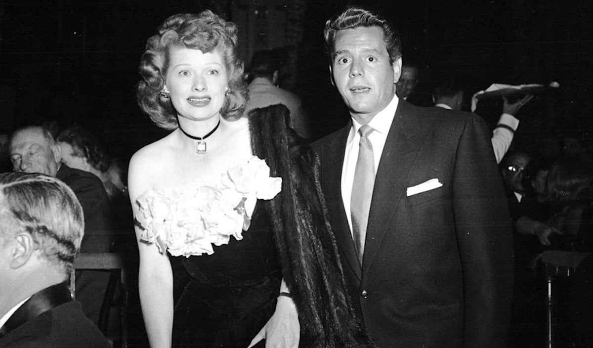 Lucille Ball and Desi Arnaz wearing formal wear to a charity dinner.