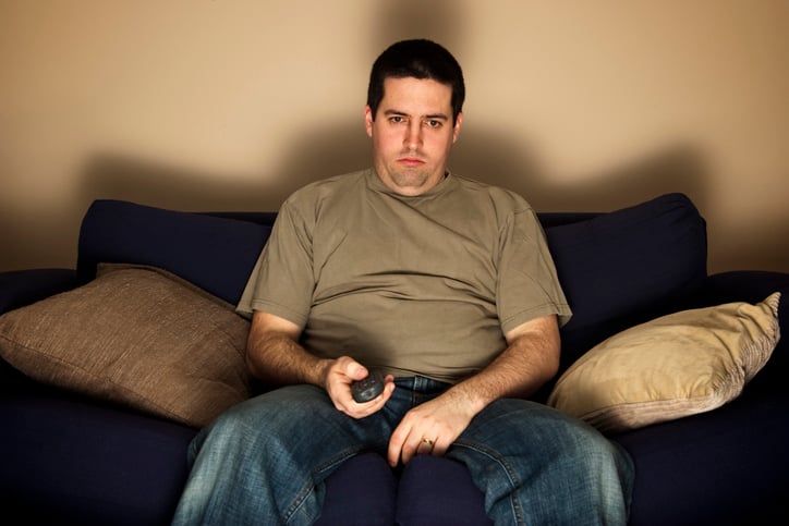 Man watching tv on the couch