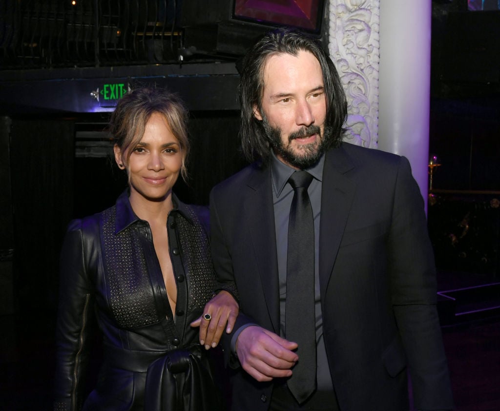 Halle Berry (L) and Keanu Reeves