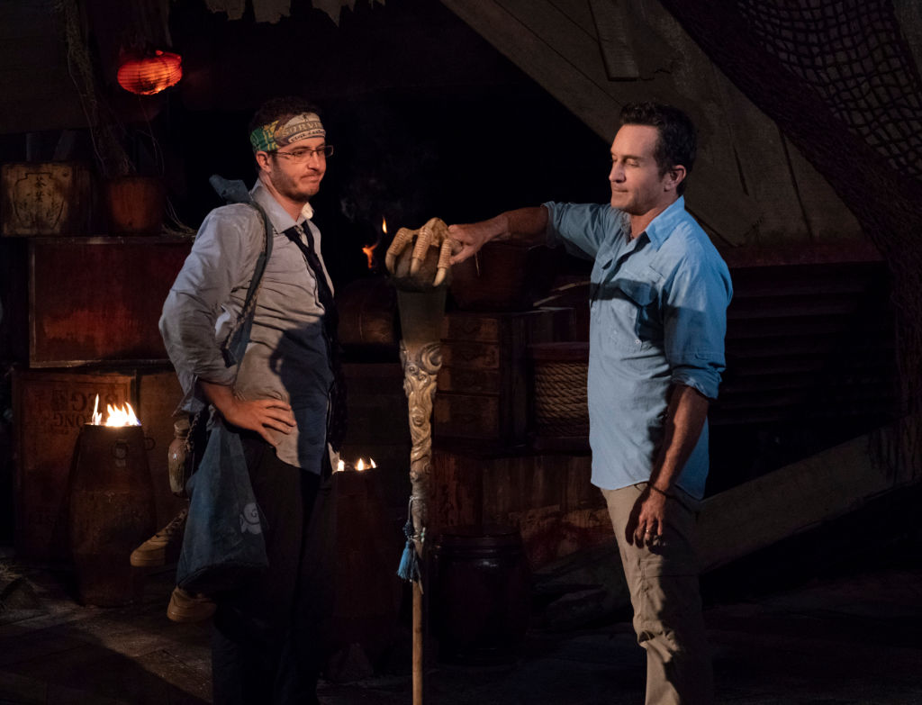 Jeff Probst extinguishes Rick Devens' torch at Tribal Council